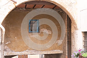 Barred window under the arch