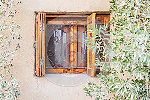 Barred window with wooden shutters in the village of Faiyum