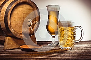 Barrel and beer in glasses