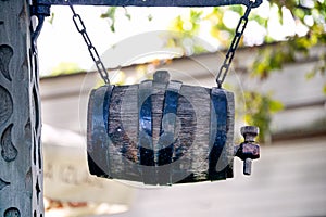 A barrel of beer is suspended in the air at the entrance to the cafe