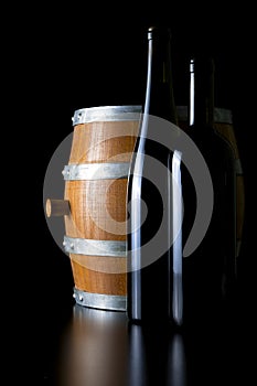 Barrel and bottle, decoratively presented.