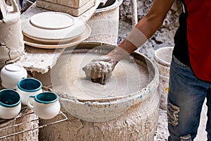 Barrel filled with mix for the clay injection molding technique in a traditional ceramics factory at the small city of Raquira