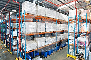 Barrel and goods arranged on a rack in warehouse