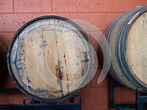 Barrel of imperial beer in aged barrel with leaks and rust in brewery