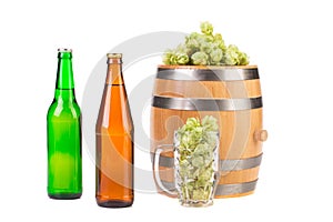 Barrel mug with hops and bottles of beer.