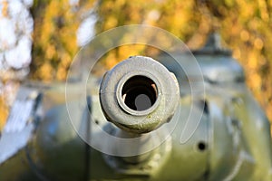 Barrel with a tank close-up. A close up shot of a rusty military tank gun, tank canon. The barrel of the Soviet anti-tank rifle.