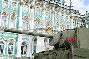 The barrel of the tank T-34 on the background of the Winter Palace in St. Petersburg.