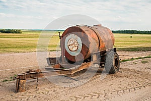 Barrel trailer with water on the field