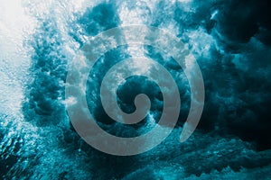 Barrel wave underwater. Blue ocean in underwater