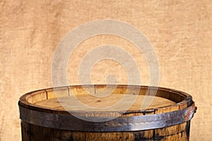 Barrel of wine on burlap background