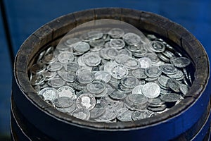 A barrell full of coins, 10 000 taler, old dollars, fortress Koenigstein, Saxony, Germany.