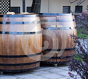 Two wooden barrels for beer in street