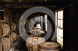 Barrels of Burbon stacked in the curing shed in Kentucky photo