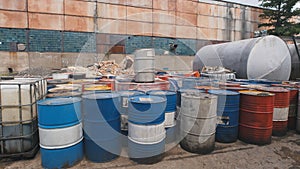 Barrels stand with spent oil products