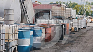 Barrels stand with waste oil and oil products