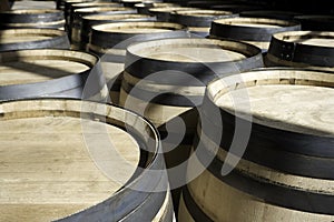 Barrels for wine stacked outside in rows