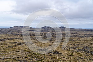 Barren, desolate volcanic landscape of Iceland, as seen from the Saxholl Crater, Snaefellsness Pensinsula photo