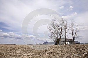 Barren field and barn