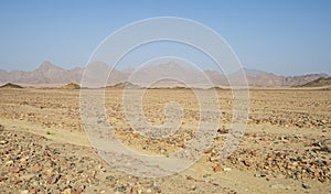 Barren rocky desert landscape in hot climate