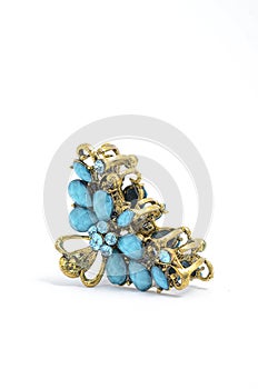 Barrette with blue stones on white background