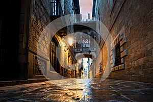 Barri Gothic Quarter and Bridge of Sighs at night in Barcelona, Catalonia, Spain photo