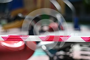 A barricade tape cordoned off a bokeh children playground.