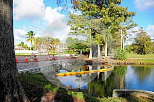 Barricades, metal retaining wall & boom in water