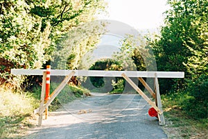 Barrier at the entrance to the forest in the middle of the road