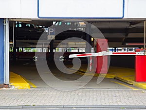 Barrier at the exit of a car parking garage with a blank sign