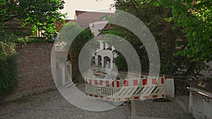 Barrier fencing of a construction site with red and white markings in Freising, Bavaria, Germany. Fencing during