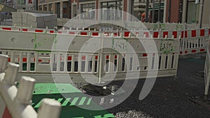 Barrier fencing of a construction site with red and white markings in Freising, Bavaria, Germany. Fencing during