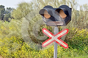 Barrier-free level crossing sign with traffic light photo