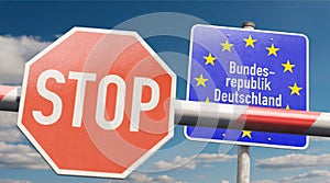 Barrier with STOP sign and info sign `Bundesrepublik Deutschland`
