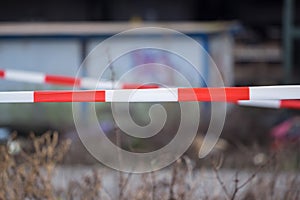 A barrier tape flutters out in the wind