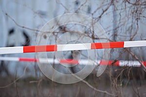 A barrier tape flutters out in the wind