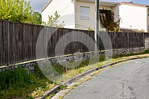 barrier wooden dark brown fence of suburb door facade