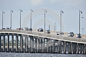 Barron Collier Bridge and Gilchrist Bridge in Florida with moving traffic. Transportation infrastructure in Charlotte