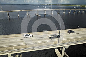 Barron Collier Bridge and Gilchrist Bridge in Florida with moving traffic. Transportation infrastructure in Charlotte