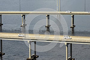 Barron Collier Bridge and Gilchrist Bridge in Florida with moving traffic. Transportation infrastructure in Charlotte