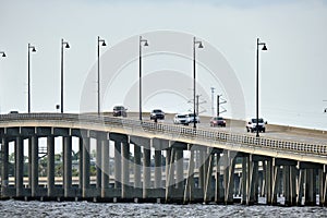 Barron Collier Bridge and Gilchrist Bridge in Florida with moving traffic. Transportation infrastructure in Charlotte