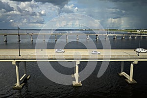 Barron Collier Bridge and Gilchrist Bridge in Florida with moving traffic. Transportation infrastructure in Charlotte