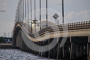 Barron Collier Bridge and Gilchrist Bridge in Florida with moving traffic. Transportation infrastructure in Charlotte