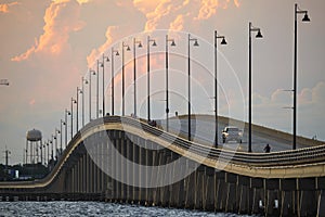 Barron Collier Bridge and Gilchrist Bridge in Florida with moving traffic. Transportation infrastructure in Charlotte