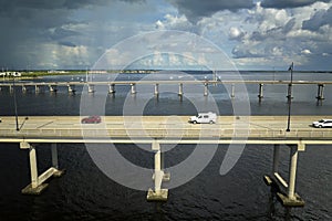 Barron Collier Bridge and Gilchrist Bridge in Florida with moving traffic. Transportation infrastructure in Charlotte