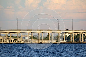 Barron Collier Bridge and Gilchrist Bridge in Florida with moving traffic. Transportation infrastructure in Charlotte