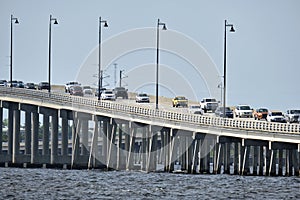 Barron Collier Bridge and Gilchrist Bridge in Florida with moving traffic. Transportation infrastructure in Charlotte