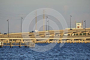 Barron Collier Bridge and Gilchrist Bridge in Florida with moving traffic. Transportation infrastructure in Charlotte