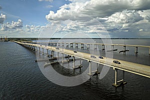 Barron Collier Bridge and Gilchrist Bridge in Florida with moving traffic. Transportation infrastructure in Charlotte