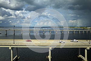 Barron Collier Bridge and Gilchrist Bridge in Florida with moving traffic. Transportation infrastructure in Charlotte