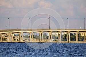 Barron Collier Bridge and Gilchrist Bridge in Florida with moving traffic. Transportation infrastructure in Charlotte